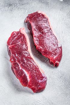 Fresh Raw sirloin beef meat steak. white background. Top view
