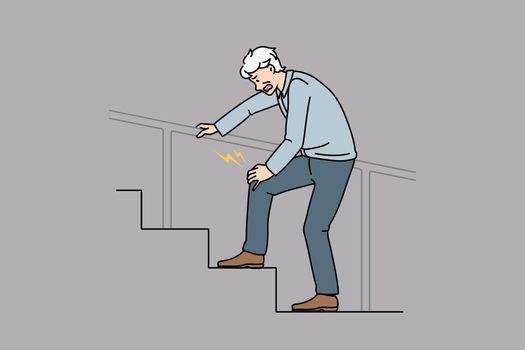 Unhealthy man walk stairs suffer from knee pain