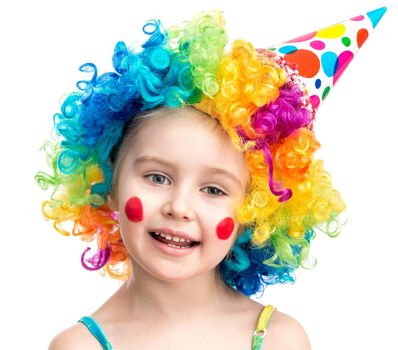 Little girl in clown wig isolated on a white background