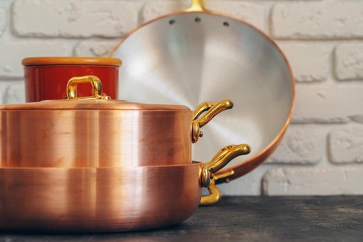 Clean copper cookware in kitchen close up