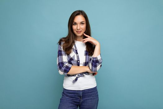 Photo shot of cute nice charming gorgeous attractive pretty youngster happy woman wearing stylish clothes isolated over colorful background with copy space