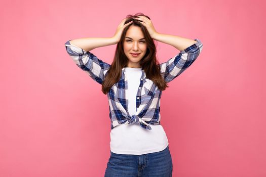Photo shot of cute nice charming gorgeous attractive pretty youngster happy woman wearing stylish clothes isolated over colorful background with copy space