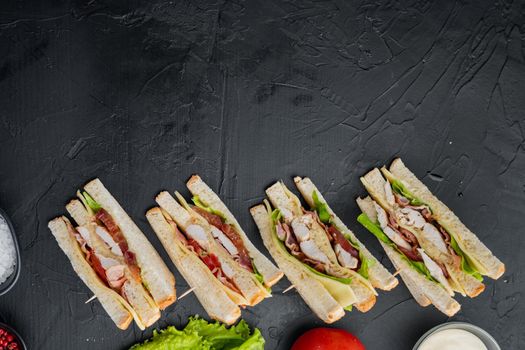 Classic club sandwich, on black background, top view with copy space for text