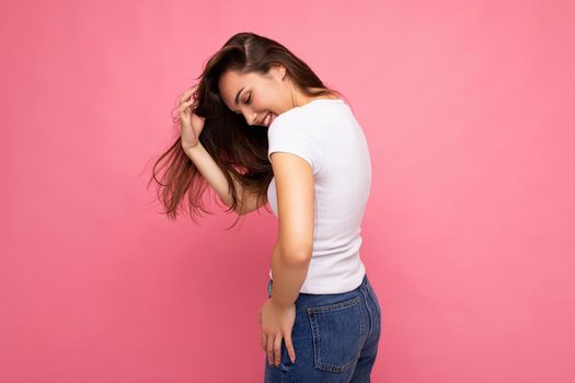 Side-profile photo shot of cute nice charming gorgeous attractive pretty youngster happy woman wearing white t-shirt for mockup isolated over colorful background with copy space