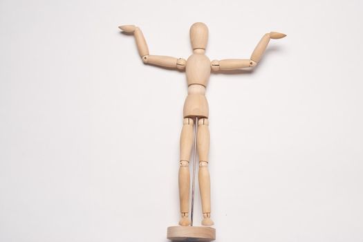 wooden mannequin toy object posing design light background
