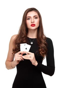 Sexy curly hair brunette posing with two aces cards in her hands, poker concept isolation on white background