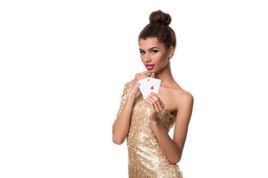 Beautiful young woman holding two ace of cards in her hand isolated on white