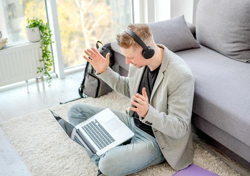 Man teleworking using online communication indoors