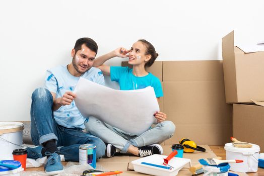 Young man and woman planning home renovation