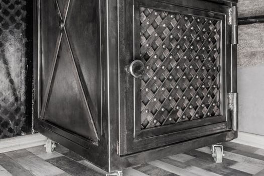 Iron box with a pattern of mesh or metal lattice in the interior of the room