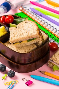 School wooden lunch box with sandwiches