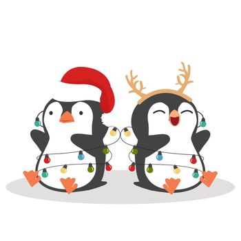 Cute little penguins wishing a Merry Christmas
