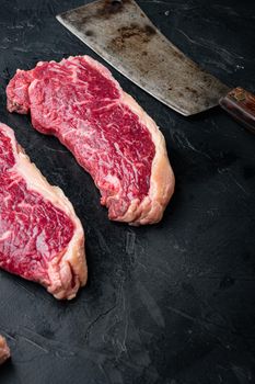 Sirloin steak, uncooked beef meat, on black background, with copy space for text