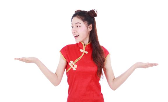 woman wear red cheongsam with open hand palm in concept of happy chinese new year isolated on white background