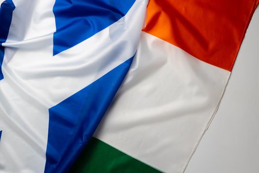 Flags of Scotland and Ireland folded together