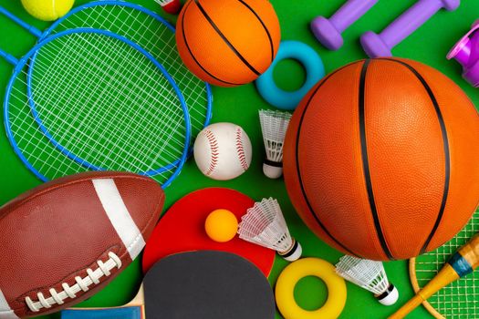 Composition of various sport equipment for fitness and games. Close up.