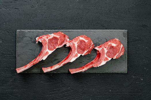 Raw fresh lamb ribs on dark background