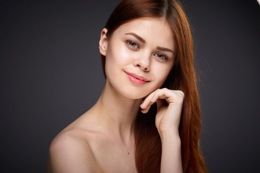 woman with bare shoulders and beautiful hairstyle close-up attractive look