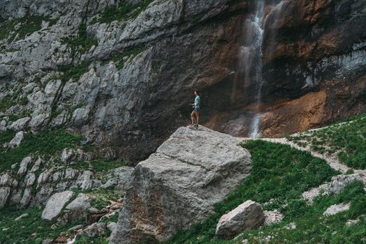Traveler walking in rocky mountains