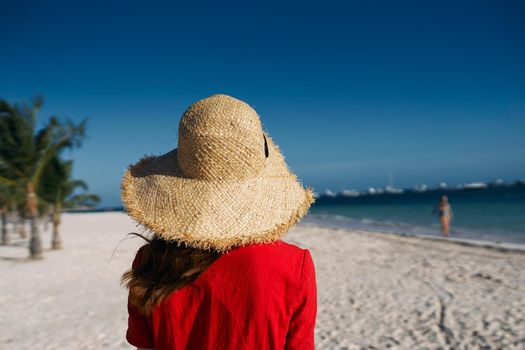 woman in hat on island landscape summer tropics