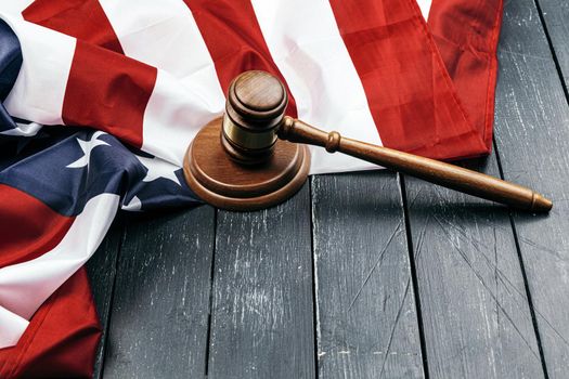 Judge gavel on the background of the flag united states of America