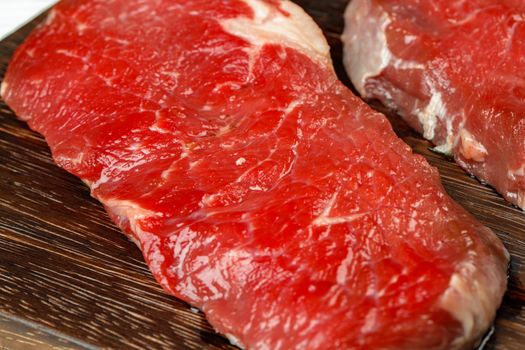 Close up of fresh uncooked rib eye steak