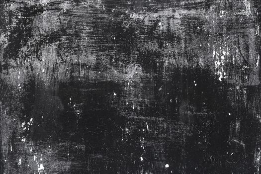Old scratched grunge black painted metal surface texture background.