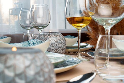 Table setting with stylish dishware on beige tablecloth