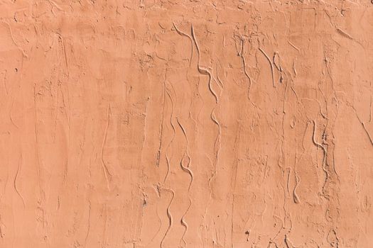 Light brown plaster wall with abstract stucco pattern texture background