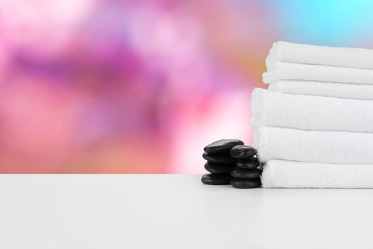 Spa still life with stacked stones and towels