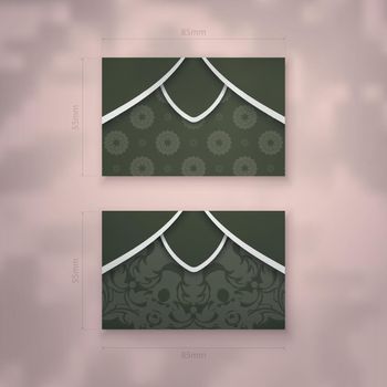 Business card in dark green color with an abstract white pattern for your contacts.