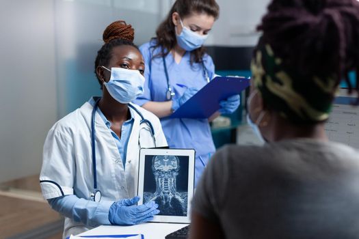 African american radiologist doctor explaining radiography expertise