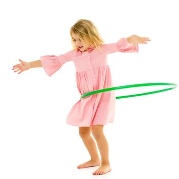 Beautiful Barefoot Girl in Pink Dress Standing with Hula Hoop