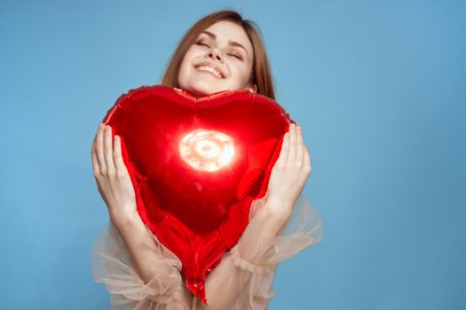 pretty woman red heart balloon fashion love romance blue background. High quality photo