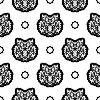Black and white Seamless pattern with tiger face in Polynesian style. Good for garments, textiles, backgrounds and prints. Vector illustration.