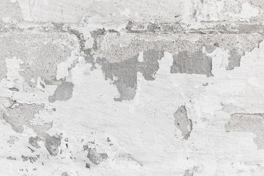 Texture of old concrete wall with white peeling stucco background