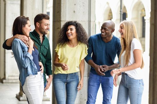 Multi-ethnic group of friends having fun together in urban background