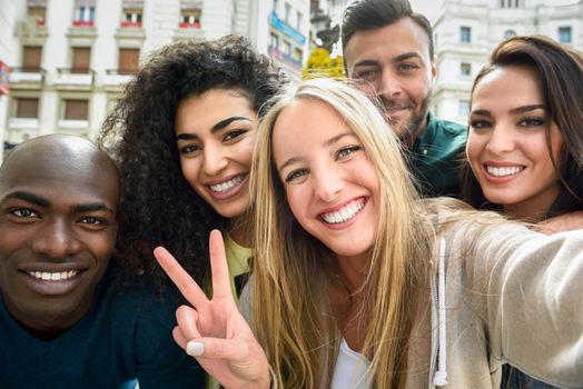 Multiracial group of young people taking selfie
