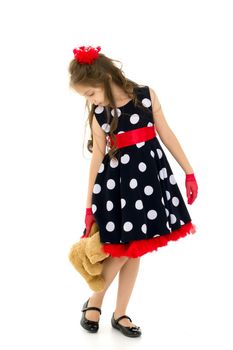 Pretty Long Haired Girl Wearing Polka Dot Dress Posing with Teddy Bear