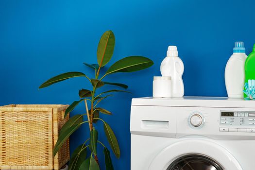 Bottle of detergent whith washing machine, indoors