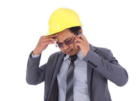 engineer receiving bad news on the cell phone isolated on white background