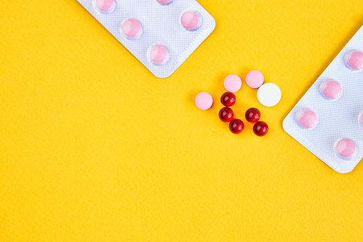 pill packaging vitamins antibiotics pharmaceutical yellow background