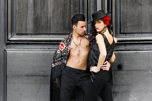 Beautiful couple, models of fashion, wearing spanish clothes