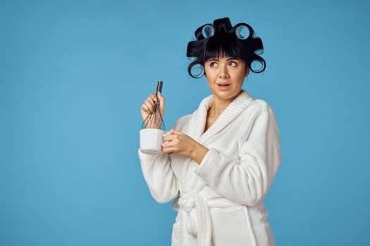 Woman in white robe kitchen utensils homework