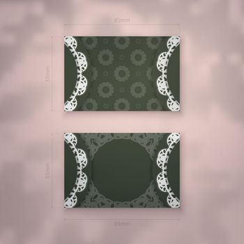 A presentable dark green business card with a vintage white pattern for your contacts.