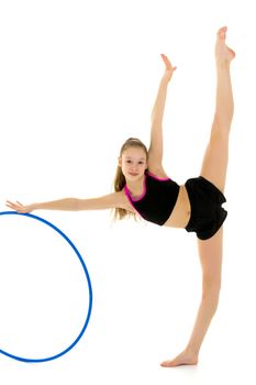 Side View of Gymnast Girl Doing Vertical Splits with Hoop