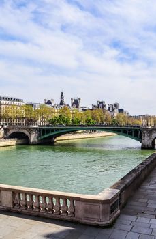 Beautiful cityscape of Paris, bridge Pont Sully across Seine river. France. April 2019