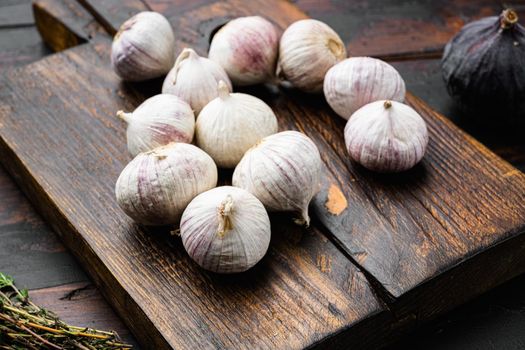 Bio garlic from bio herbs garden, on old dark wooden table background