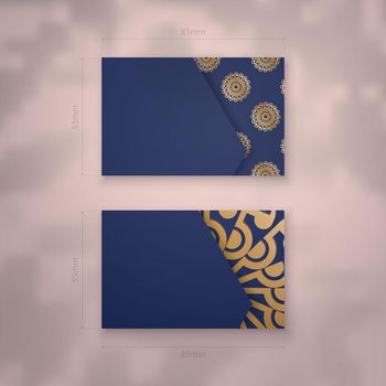 Visiting business card in dark blue with Indian gold ornaments for your brand.