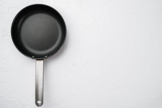 Empty skillet, frying pan with copy space for text or food with copy space for text or food, top view flat lay , on white stone table background